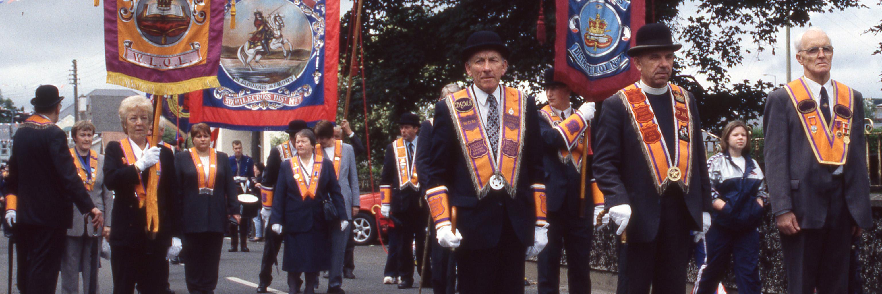 Image of people marching in a parade.
